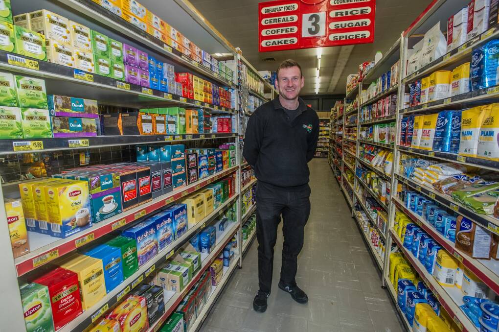 Brendan Irvine, who has brought the Red Hill supermarket with two partners, has been blown away by the warm welcome from locals. Photo: Karleen Minney