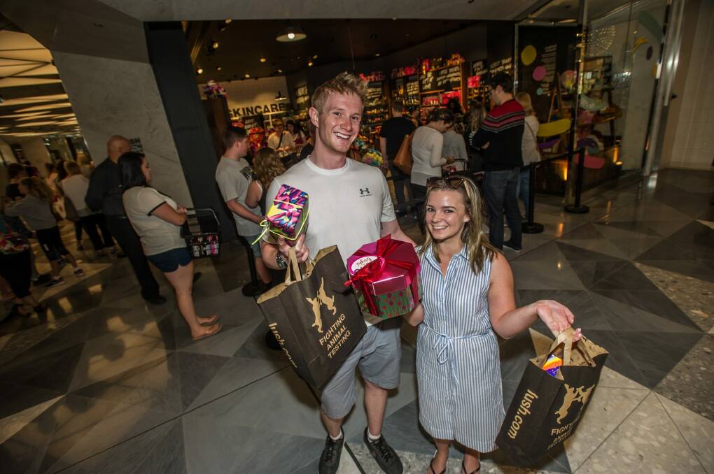 Lush customers Hugh Kirk and Laura Jennings of Sydney do their annual stock up at the Canberra Boxing Day sales. Photo: karleen minney