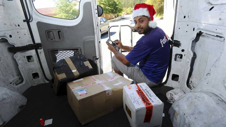 Courier driver, Mandip Singh, makes his final delivery for the day on Friday, to a home in Isaacs. Photo: Graham Tidy