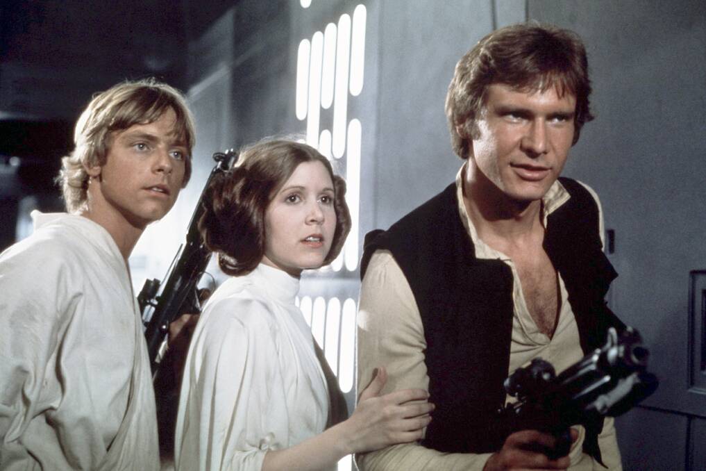  Mark Hamill, from left, as Luke Skywalker, Carrie Fisher as Princess Leia Organa, and Harrison Ford as Hans Solo in the original 1977 <Star Wars: Episode IV - A New Hope.?  Photo: AP
