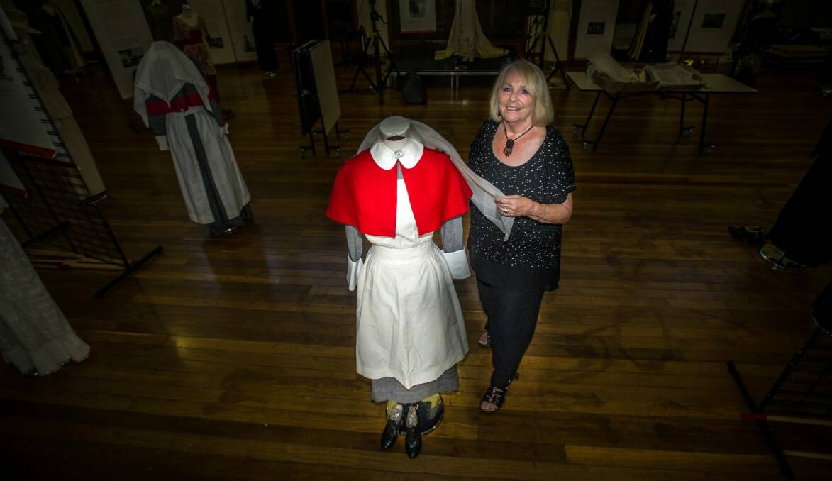 Curator Fiona Baverstock installs items from the Women of Empire Exhibition 1914-1919 at the Natioanl film and sound archive. Photo: karleen minney