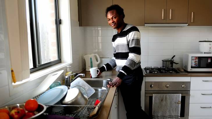 New life ... Nigerian refugee Richard Ezomoh at his rental property in Macgregor. Photo: Melissa Adams