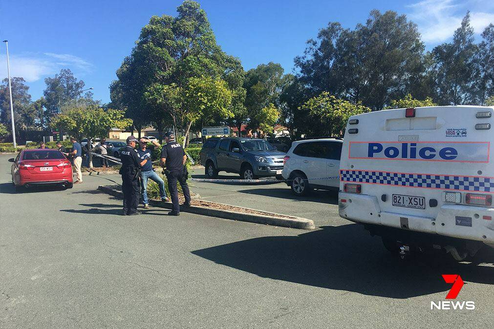 Police respond to a shooting outside Currimundi Markets on the Sunshine Coast. Photo: Seven News.