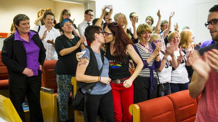 Julie Maynard and Frances Bodel, from Belconnen, celebrate in the public gallery after the same-sex bill is passed. Photo: Rohan Thomson
