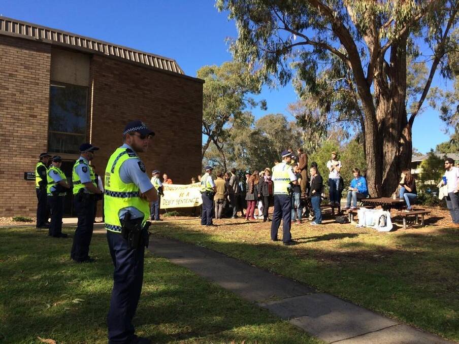 Armed police officers greeted protesters at Australian National University's (ANU) Acton campus. Photo: Primrose Riordan