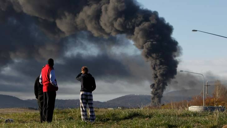 Canberra residents observe smoke rising from the Mitchell chemical fire on September 16, 2011. Photo: Alex Ellinghausen