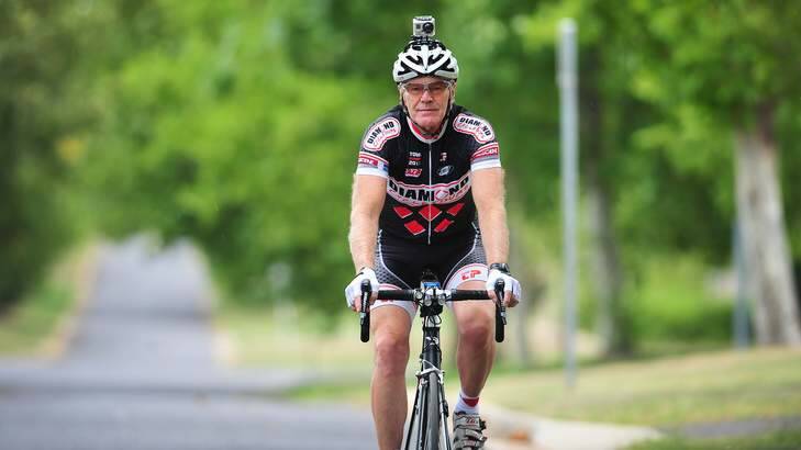Rob Diamond, president of the ACT Vets cycling club, uses a bike camera. Photo: Katherine Griffiths