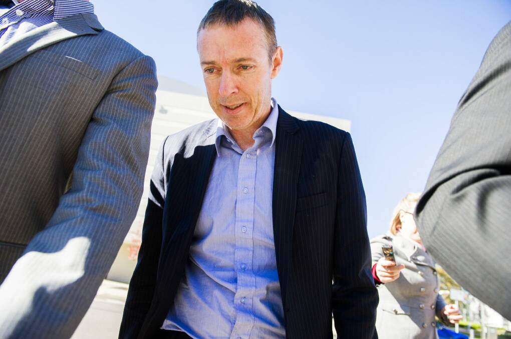 The government's chief NBN adviser Stephen John Ellis leaves the Magistrates Court in Canberra on bail after being arrested overnight for public indecency charges. Photo: Rohan Thomson
