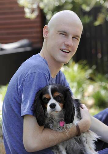 James Franklin, with dog Ash, is raising money for "Movember" but because of his cancer treatment, is unable to grow a moustache. He is currently the third highest money raiser in the ACT. Photo: Graham Tidy