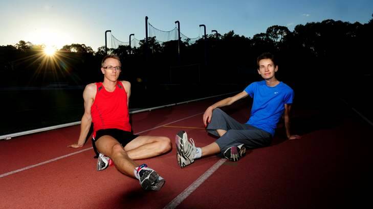 Race walker Jared Tallent and wife Claire - who now coaches the Olympic medallist - contemplate their future during a break at the AIS athletics track. Photo: Melissa Adams
