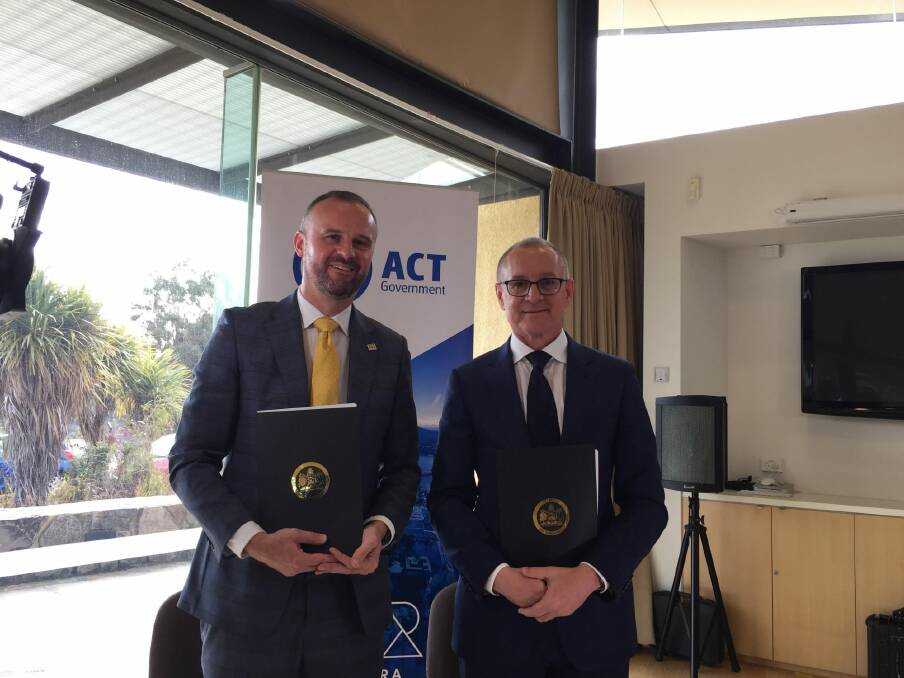 ACT Chief Minister Andrew Barr and South Australia Premier Jay Weatherill signed a memorandum of understanding between their two governments to work together to put Australian into the space race in August. Photo: Finbar O'Mallon