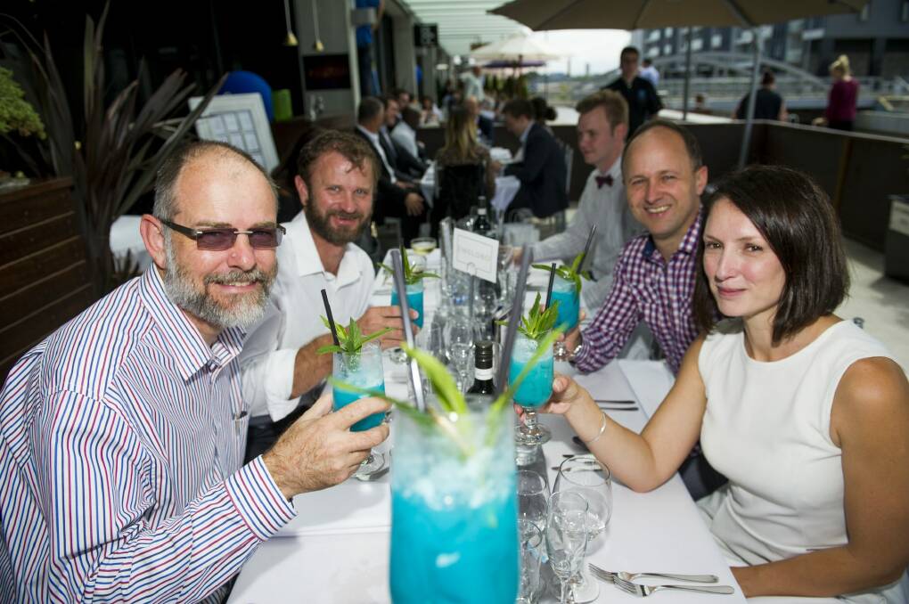 (L-R) John Reed, Pete Shaw, Paul Middleton and Lyndell Roberts of XACT enjoying the Blue themed Long Lunch for Asthma at the Kingston Foreshore. Photo: Jay Cronan
