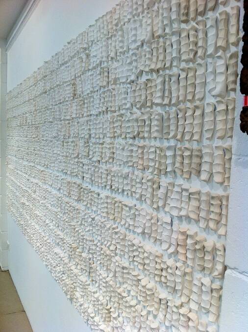 Small, white ceramic pieces of clay moulded from human knuckles on two walls of the gallery represent the 8709 Australian soldiers killed at Gallipoli. Photo: Supplied