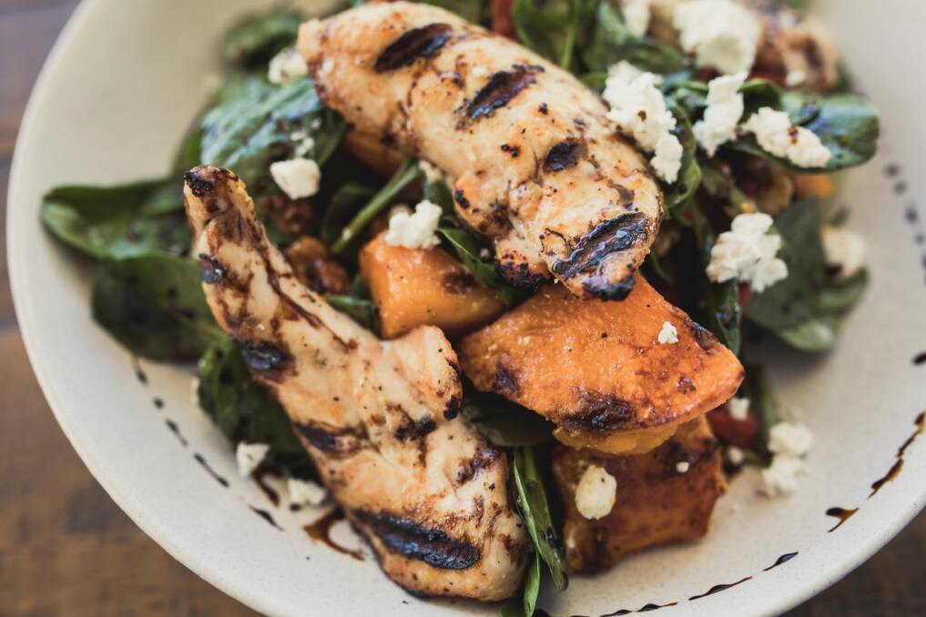 Warm chicken and pumpkin salad with roast peppers, spinach, walnuts, feta and a white balsamic dressing. Photo: Jamila Toderas
