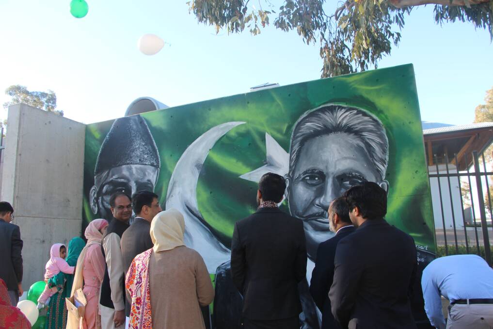 The crowd at the opening of the striking mural on the Pakistan High Commission in Canberra. Photo: Supplied