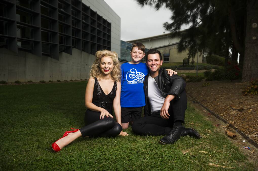 The musical Grease will be on at the AIS Arena this weekend. Ashleigh Taylor as Sandy and Thomas Lacey as Danny with Edward Murphy 10.  Photo: Dion Georgopoulos