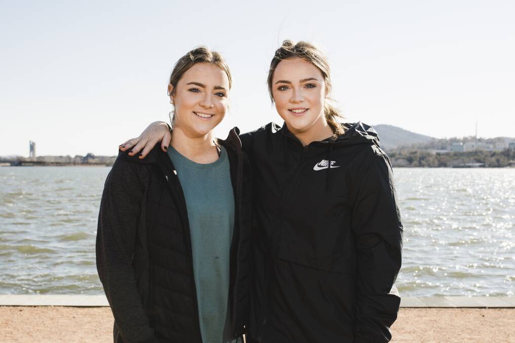 Twin sisters Olivia and Georgia Fogarty both tore their ACL's within about a month of each other, had surgery a day apart and are now on the road to recovery together. Photo: Jamila Toderas