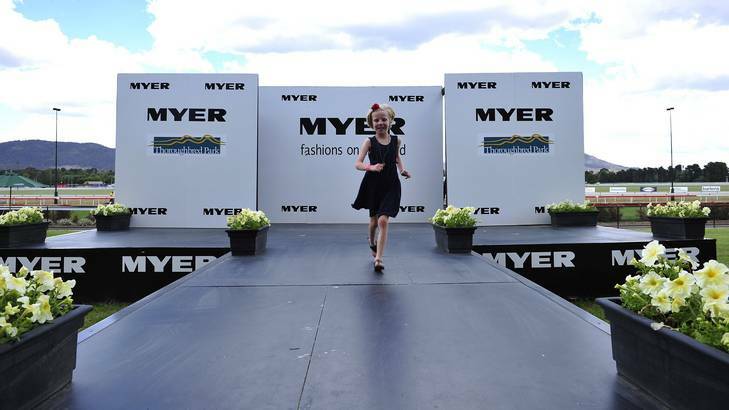 Seven-year-old Lily Haskin, who suffered at cardiac arrest last year, takes time out from the Bigger Than Phar Lap's Heart Race Day to play on the Fashions on the Field runway. Photo: Jay Cronan