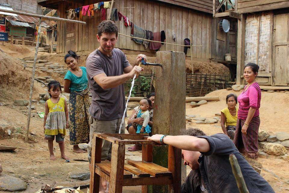 Abundant Water volunteers installing filters in a village in Laos. Photo: Facebook