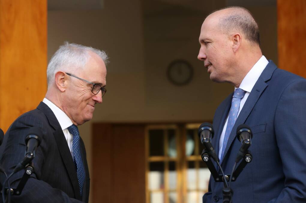 Prime Minister Malcolm Turnbull on Tuesday with Immigration Minister Peter Dutton, who will take on the Home Affairs portfolio. Photo: Andrew Meares
