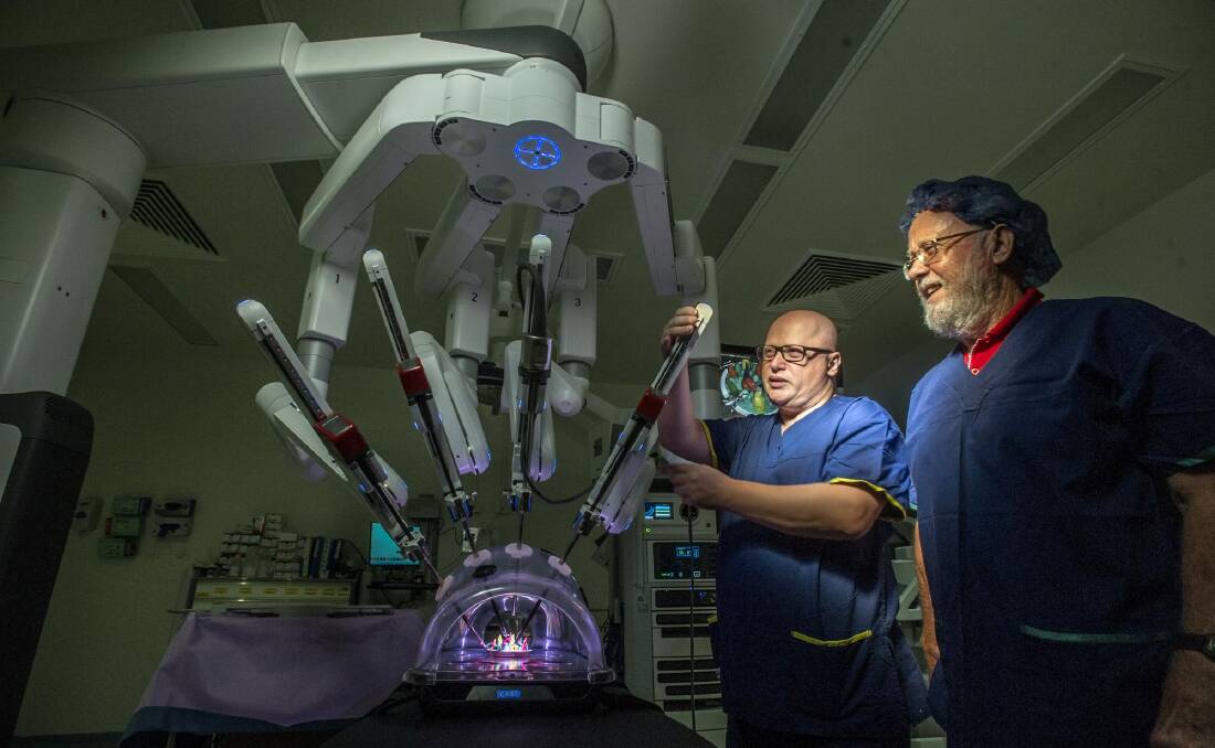 Dr Hodo Haxhimolla (no hat) has performed surgery using the da Vinci Xi Surgical System. His first patient was Jim Alexander of Kambah who had a radical prostatectomy with the help of the  da Vinci Xi robot, the first of its kind in the ACT. Photo: karleen minney