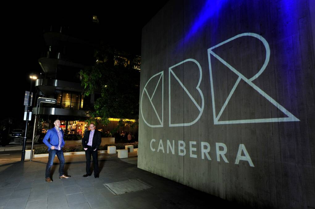 Directors of Coordinate Jamie Wilson and Warren Apps next to the projection of the official logo in 2013. Photo: Melissa Adams