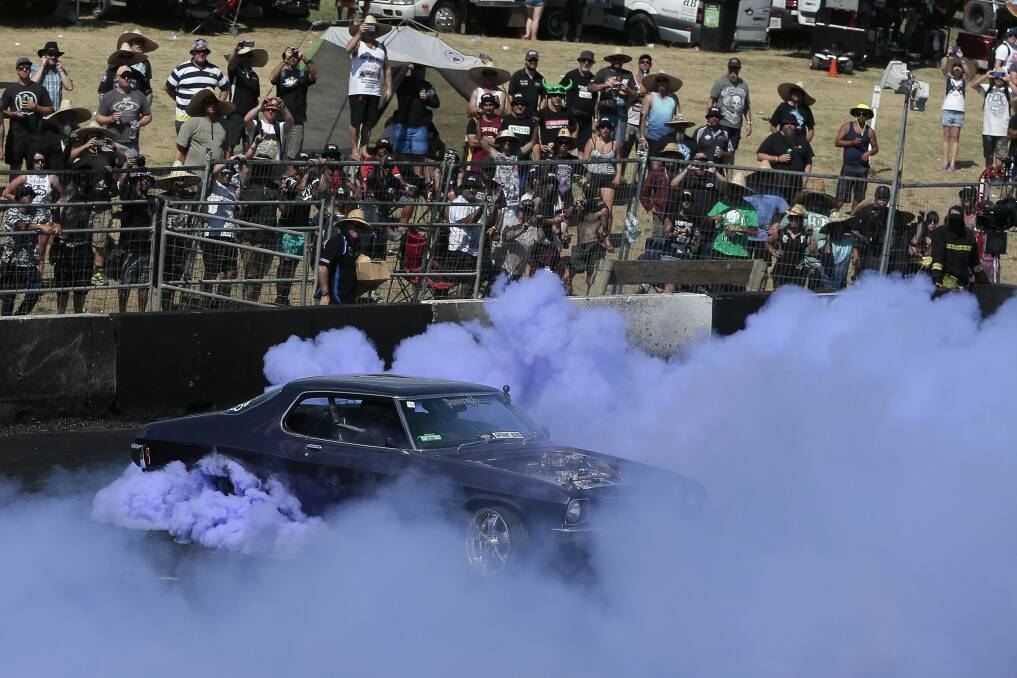 A driver takes part in the Burnout Championship finals at Canberra Summernats. Photo: Jeffrey Chan