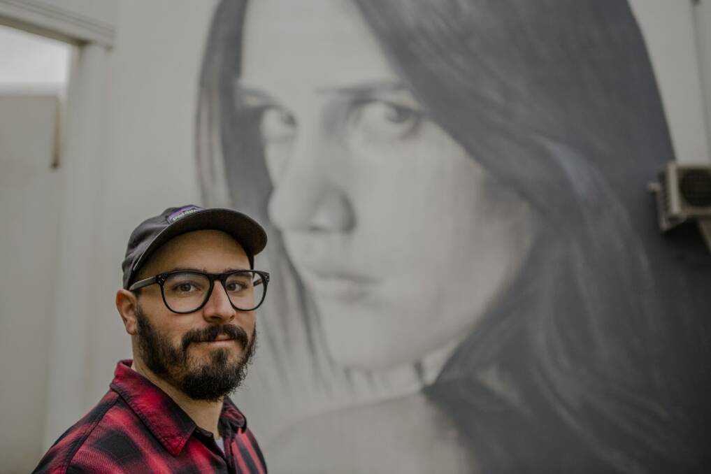 Street artist Rone, who specialises in larger-than-life images of faces. Photo: Jamila Toderas