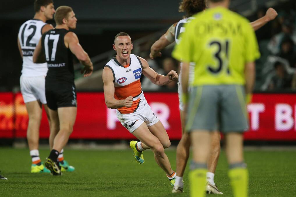 Silencing their critics: Tom Scully celebrates a goal against Port Adelaide Power at the Adelaide Oval in July. Photo: James Elsby/AFL Media