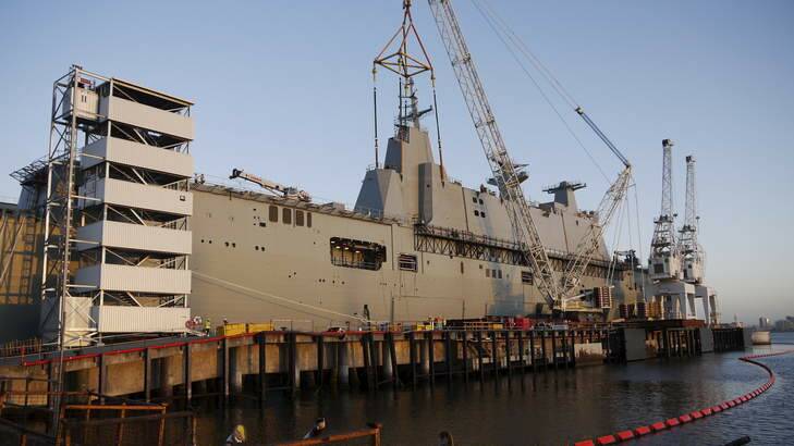 CAPITAL AFLOAT: HMAS Canberra is almost 28,000 tonnes. The combined cost of Canberra and its sister ship, Adelaide, will be more than $3.1 billion. Photo: Supplied
