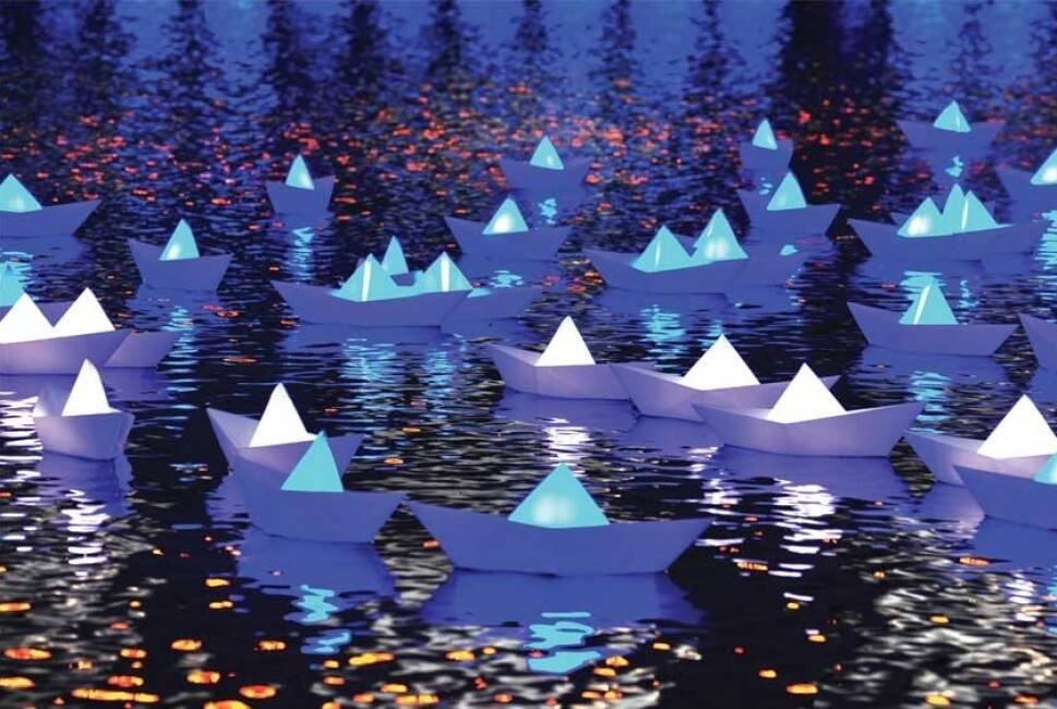 Three hundred illuminated paper boats will float on the lake during Enlighten. Photo: Supplied