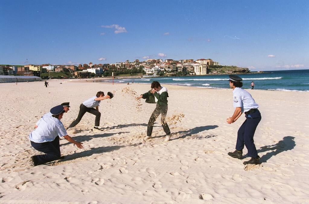 A re-enactment of the fatal police shooting of Roni Levi on Bondi Beach in 1997. Photo: Rick Stevens