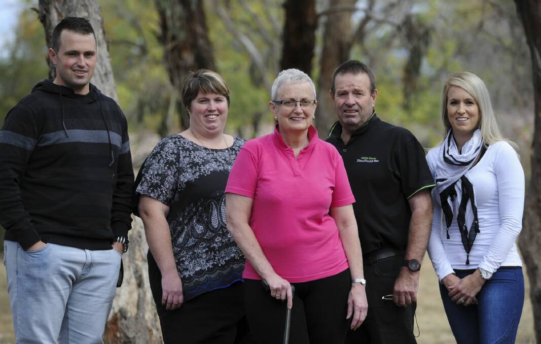 Multiple sclerosis sufferer, Anne Hill (centre) with family members near her home. From left, son Simon Hill, daughter Kristen Hill, husband David Hill and daughter Laura Elphick. Photo: Graham Tidy