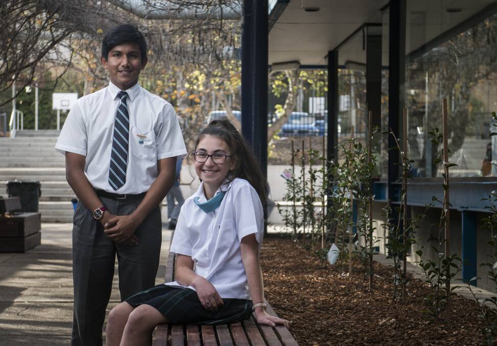 St Mary MacKillop College year 7 students Justine Rasheed and Ishan Ahmed discuss what they think about global warming and climate change. Photo: Elesa Kurtz