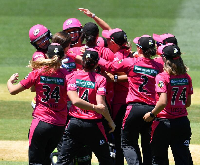 Title moment: The Sydney Sixers celebrate winning after the final of the Women's Big Bash League. Photo: AAP