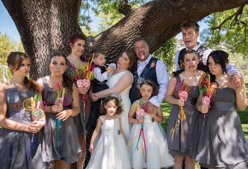 A family that mugs together stays together. A fun photo of Fiona and James Lester with their nine children at their wedding in 2013. Photo: Supplied
