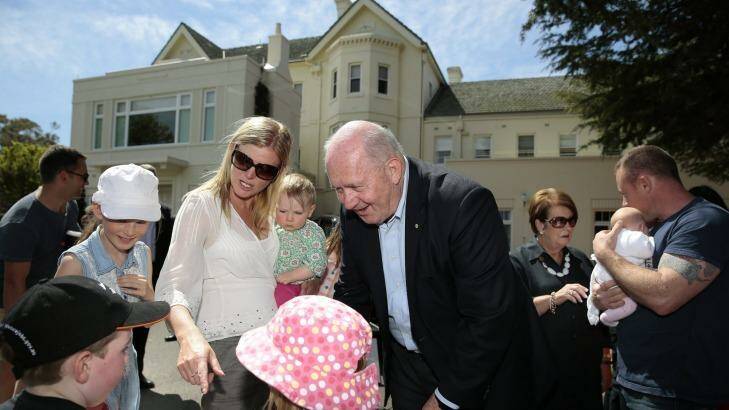 Governor-General Peter Cosgrove meets, rear from left, Paris Morris 12, Catherine Morris, Eleana Campbell, 1, front from left, William Campbell, 5, and Amity Morris, 7, during the Government House open day. Lady Lynne Cosgrove can be seen in the background in black. Photo: Jeffrey Chan