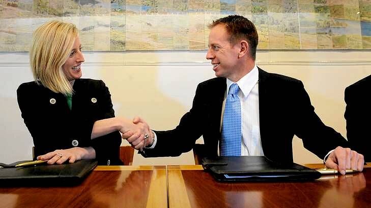 ACT Chief Minister Katy Gallagher and Greens MLA Shane Rattenbury are all smiles after signing the agreement. Photo: Colleen Petch