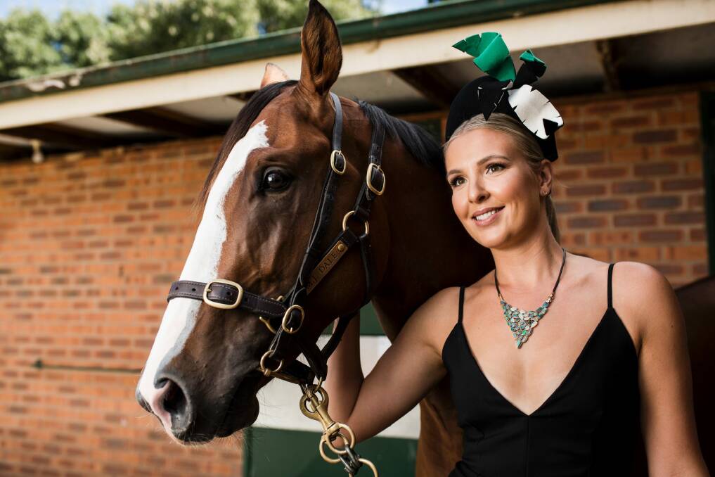 Thoroughbred Park Racing Ambassador Kate Speldewinde sported the ultimate accessory for this weekend's Black Opal Stakes - a $25,000 neckpiece comprising Lightning Ridge black opals made by Vangeli Manufacturing Jewellers in Woden, Canberra-trained 2-year-old colt Mossman Gorge will be racing in the Black Opal Stakes on Sunday..  Photo: Jamila Toderas