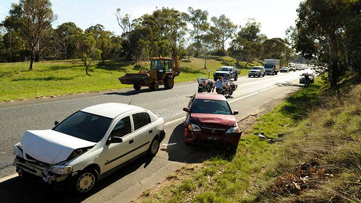 Traffic chaos on Canberra Ave near HMAS Harman due to a multi-car crash this morning. Photo: Colleen Petch