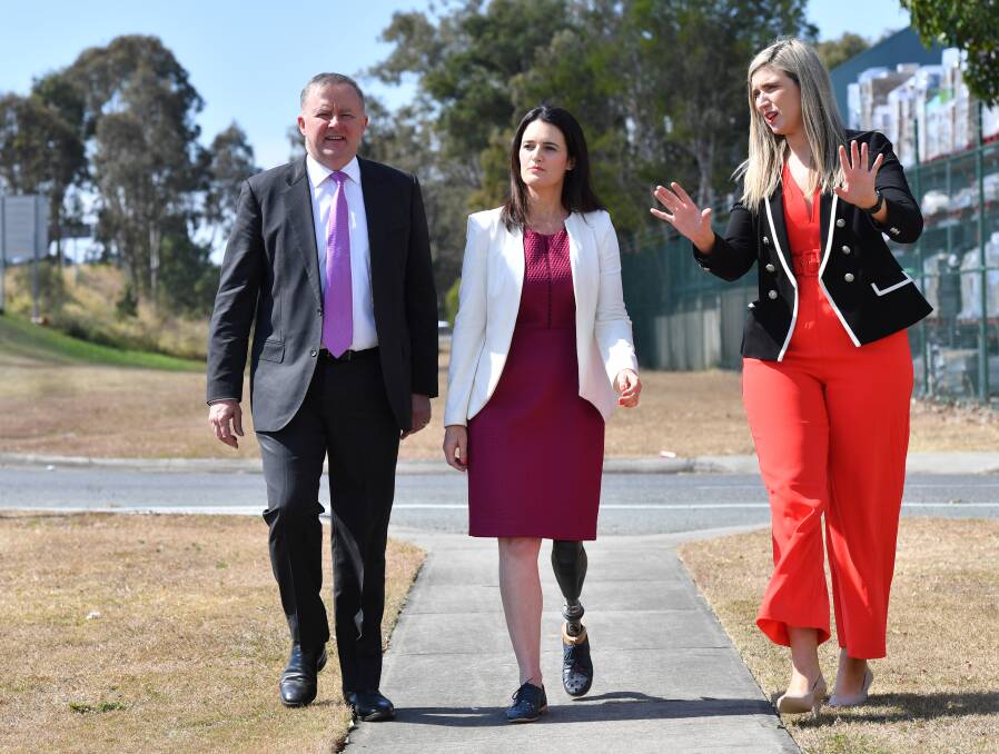 Corinne Mulholland (right) on the campaign trail with Anthony Albanese and Labor's Dickson candidate, Ali France. Photo: Darren England/AAP
