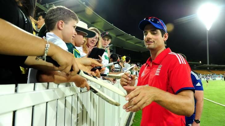 England Captain Alistair Cook signs autographs after the PM's XI game. Despite the win, Cook still failed with the bat. Photo: Melissa Adams