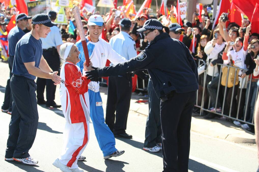 Canberran Stasia Dabrowski completes a leg of the Beijing Olympic torch relay in 2008. Photo: Renee Nowytarger
