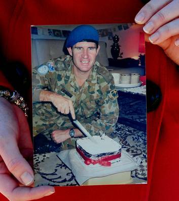 Sarah McCarthy holds a photo of her father, Captain Peter James McCarthy who was killed in Lebanon in 1988 as a peacekeeper. Photo: Melissa Adams