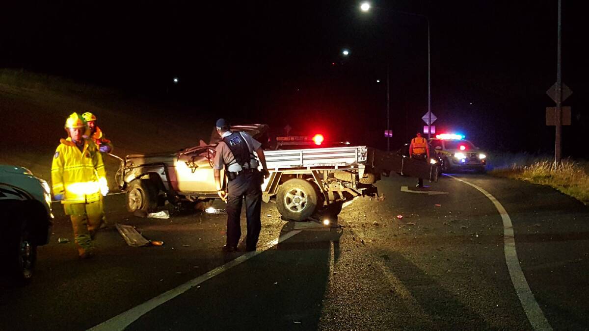 Police and firefighters on the scene of a crash on Horse Park Drive on Tuesday night. Photo: Supplied