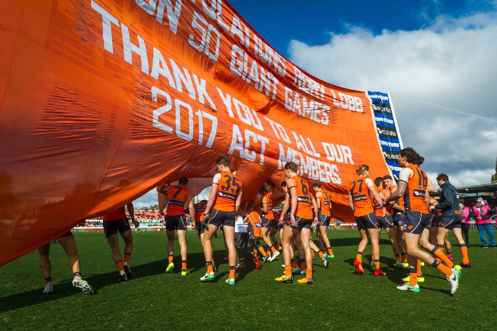 The Giants run out to play the Demons in Canberra in 2017. Photo: Dion Georgopoulos