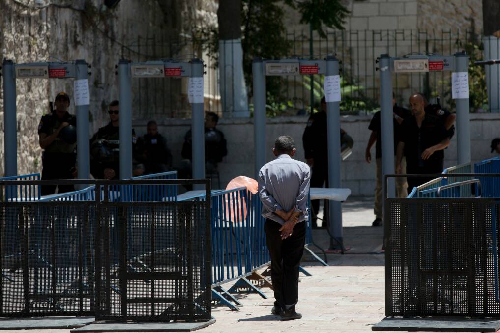 A Palestinian man walks towards a metal detector at the Al-Aqsa Mosque compound in Jerusalem's Old City. Photo: Oded Balilty