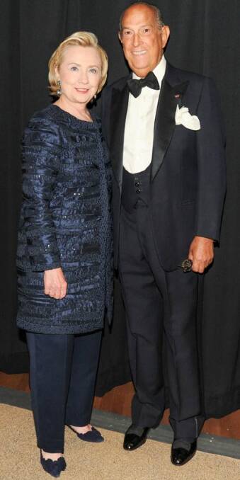 Hillary Clinton wearing an Oscar de la Renta pant suit with the designer himself at the 2013 Council of Fashion Designers of America awards.