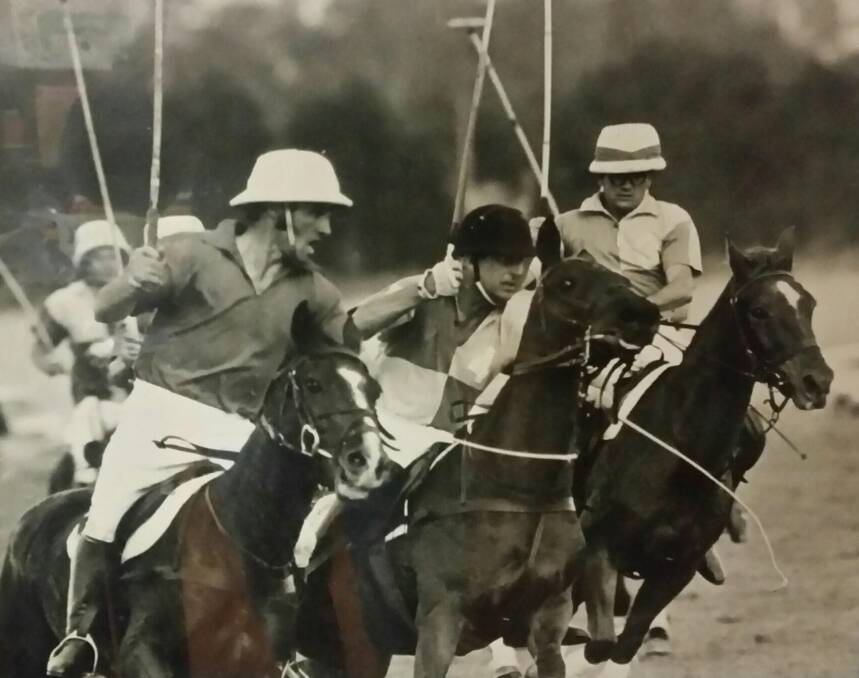 Peter Walker riding next to Prince Philip, Duke of Edinburgh in 1972, who was riding Prince Philip's horse, Buttons. They were playing a polo match at Canberra polo field. Photo: Supplied