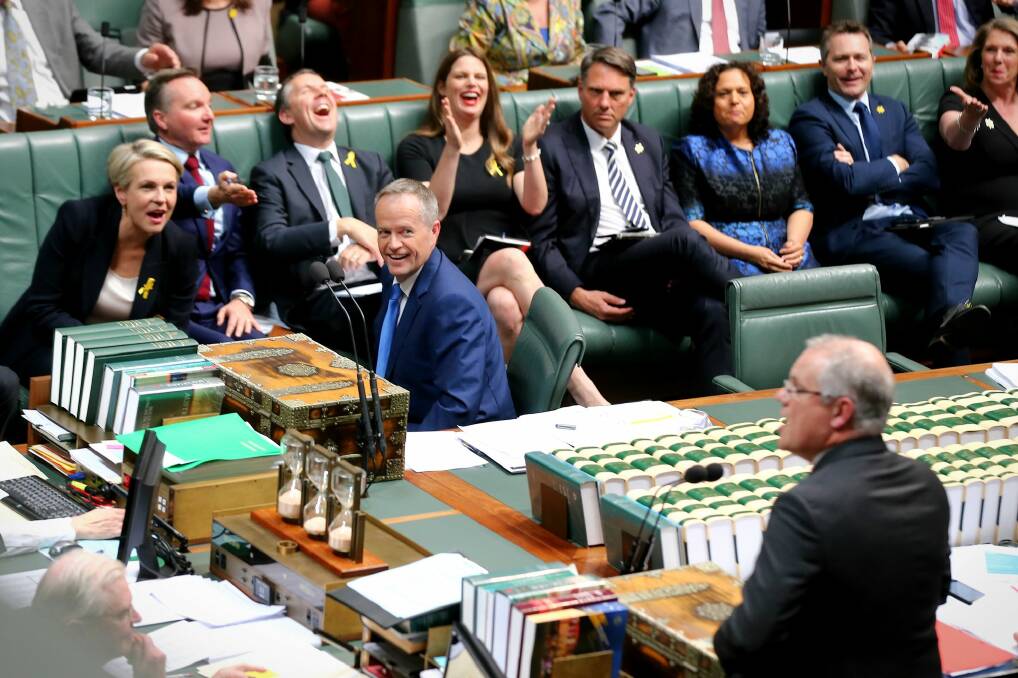 Opposition Leader Bill Shorten and his frontbench applaud and laugh as then treasurer Scott Morrison approaches the despatch box during question time in 2017. Photo: Alex Ellinghausen